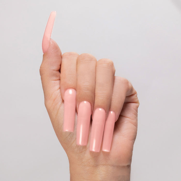 Natural Babe acyrlic powder applied to light-skinned hand