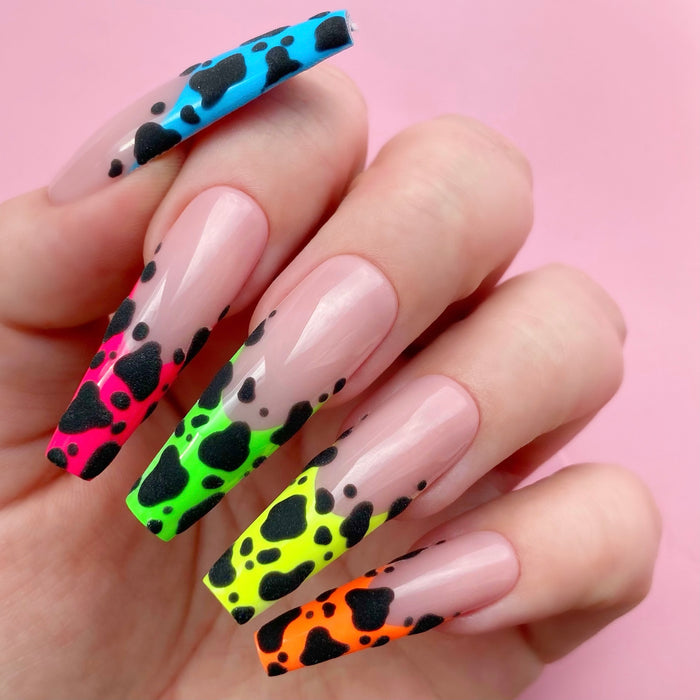 Out of Monet gel art applied to nail extensions with cow pring design