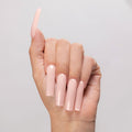 Pure Bliss acrylic powder applied to light-skinned hand