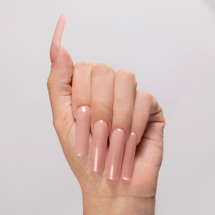 Sheer Me Out acrylic powder applied to light-skinned hand